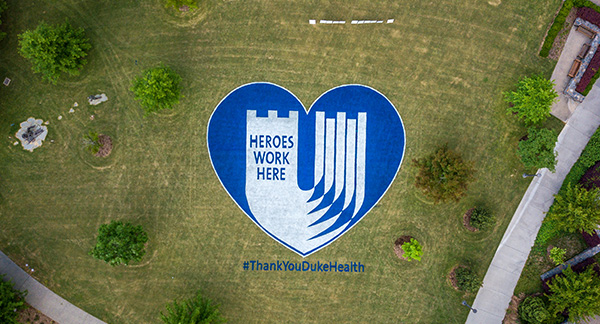 Arial View of Heroes Work Here in blue heart painted on Duke Medicine Circle Lawn