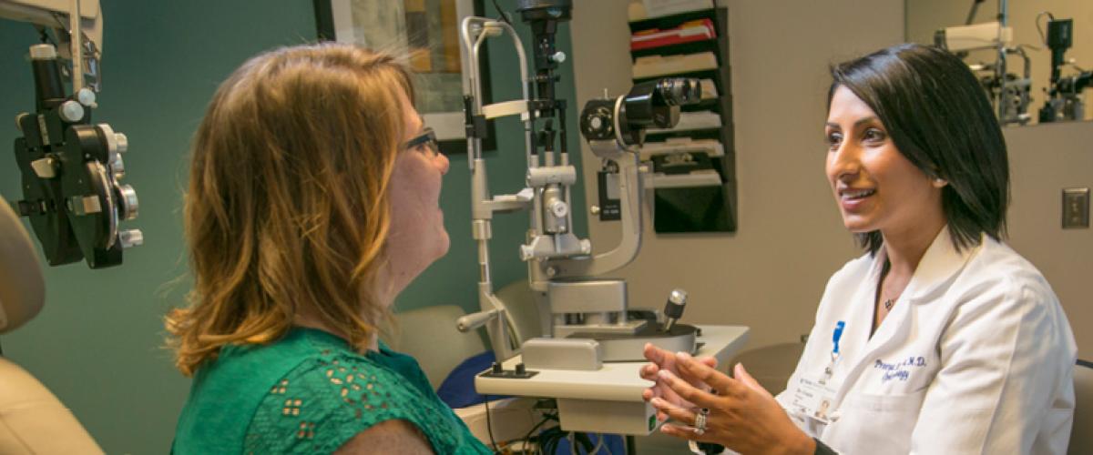 Doctor consults with patient at Duke Eye Center